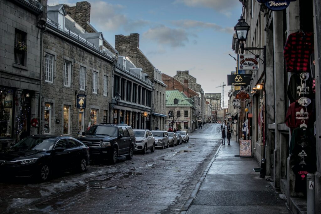 Montreal’s Old Town - vehicles park on front of building