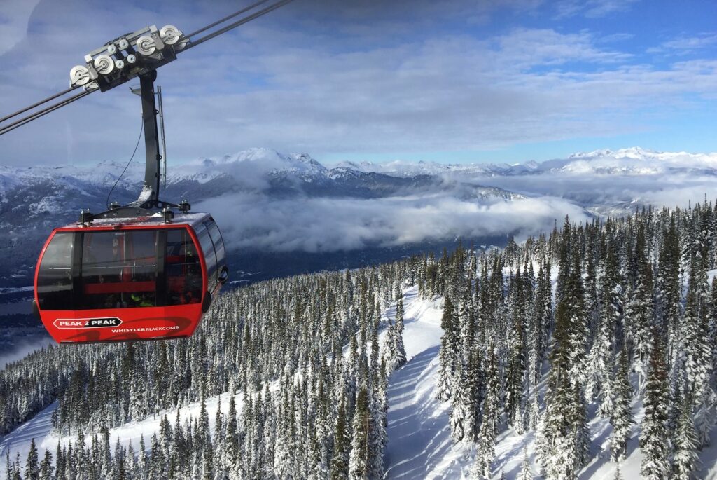 Whistler: A Mountain Paradise for Adventure Seekers - red cable car over snow covered ground